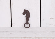 Hand held bottle opener with horse decoration