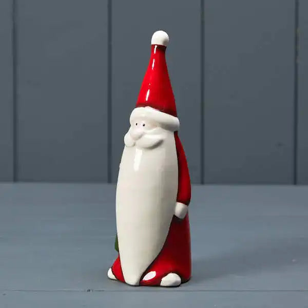 Ceramic Santa holding tree 6.5x6x17.5cm
