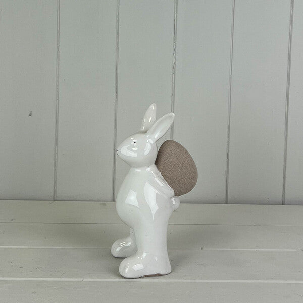 Ceramic White Rabbit holding an Egg H14.4cm W7.5cm D7.5cm  Weight-149g