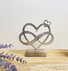 Metal Silver Entwined Hearts On A Wooden Base Small - Price Crash Furniture