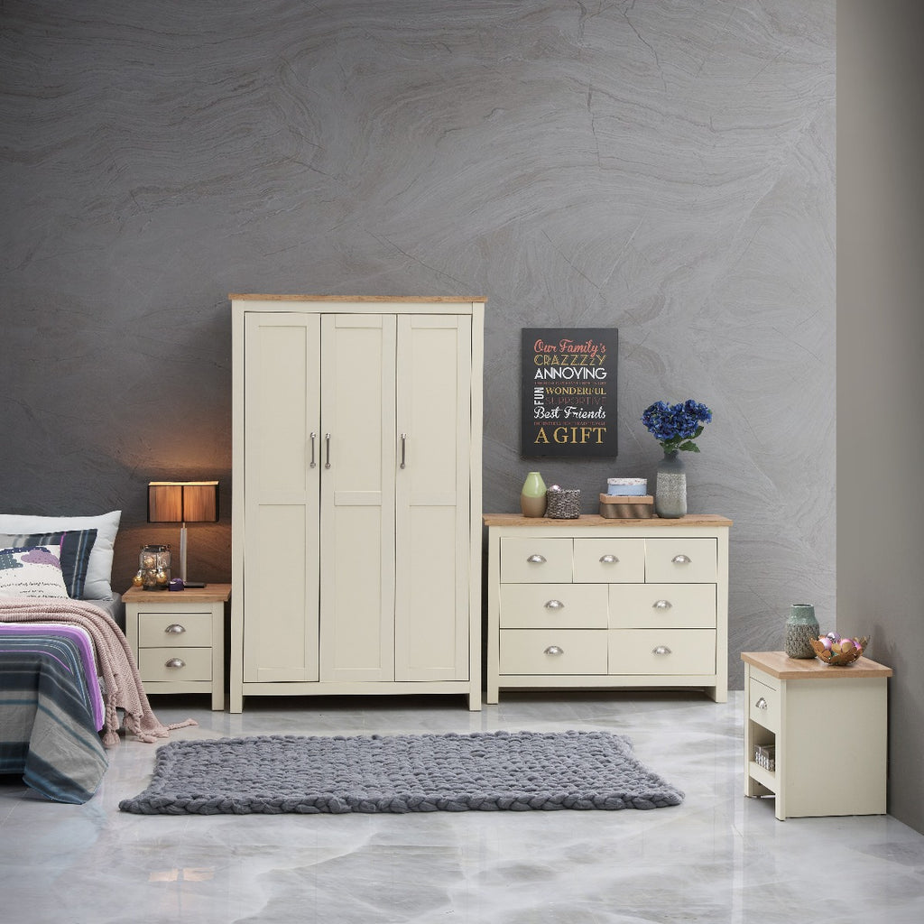 In room, lifestyle, room set view: Lisbon 7 drawer chest of drawers in cream & oak by TAD. Matching items available at Price Crash Furniture. TAD436 / 5055651731778